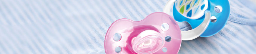 Image shows two baby dummies as an example of the application of printing inks for baby and toddler products.